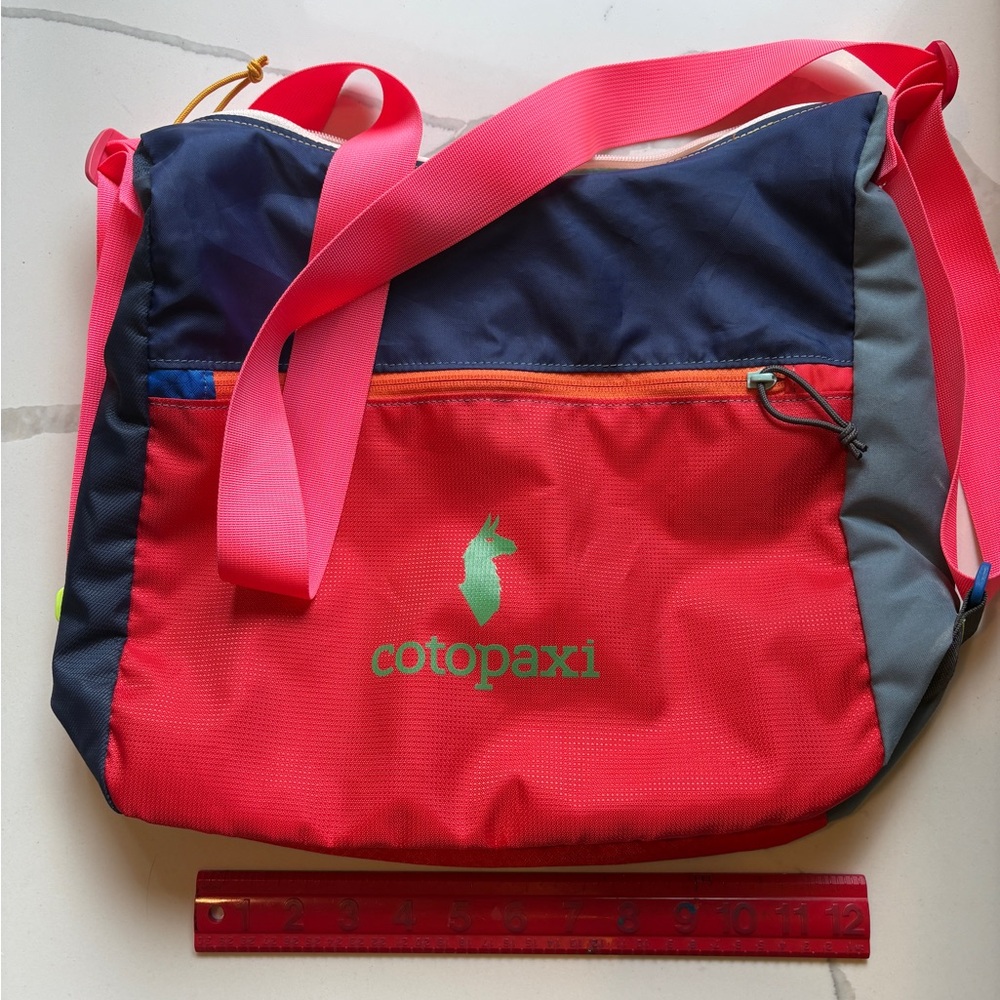 Cotopaxi Multi Colored Sling/Crossbody Bag.  Near new condition.